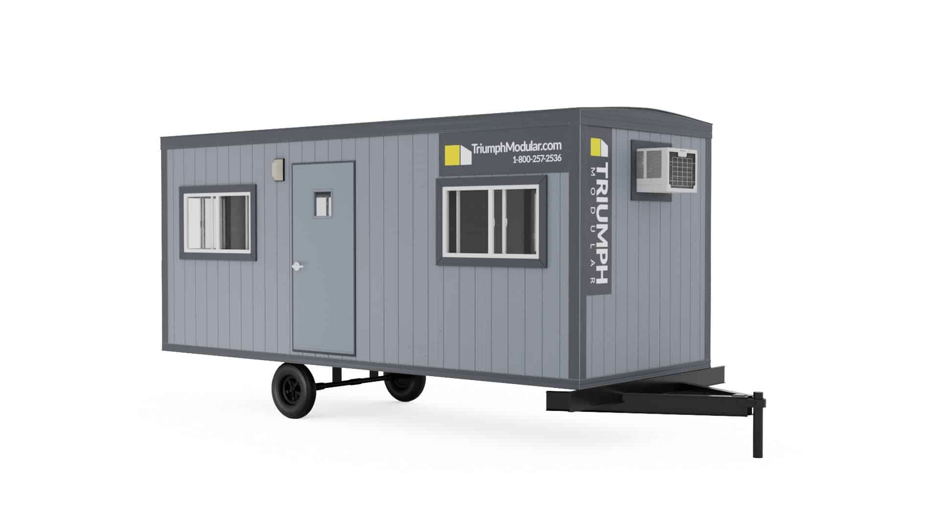 ALT text: Image of a Triumph Modular temporary modular building on wheels, showcasing a modern design with windows and a door, emphasizing the versatility of modular construction for various applications.