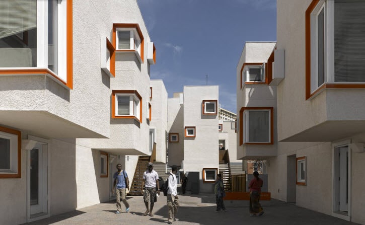 A modern modular building featuring unique architectural designs, showcasing triumph modular principles in a vibrant community setting. Ideal for both permanent and temporary modular building solutions.