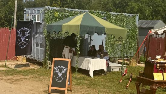 Container Office covered in vines as a temporary retail and tattoo space for the Connecticut Renaissance Faire