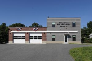 Exterior View of front of fire station with apparatus bays and two-story living quarters