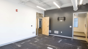 Modern interior of a modular building featuring an open layout, showcasing the flexibility of triumph modular construction.