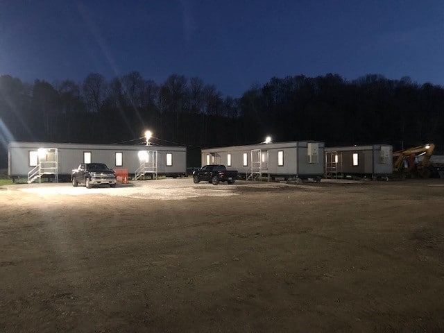 Nighttime view of three 12’60’ mobile offices