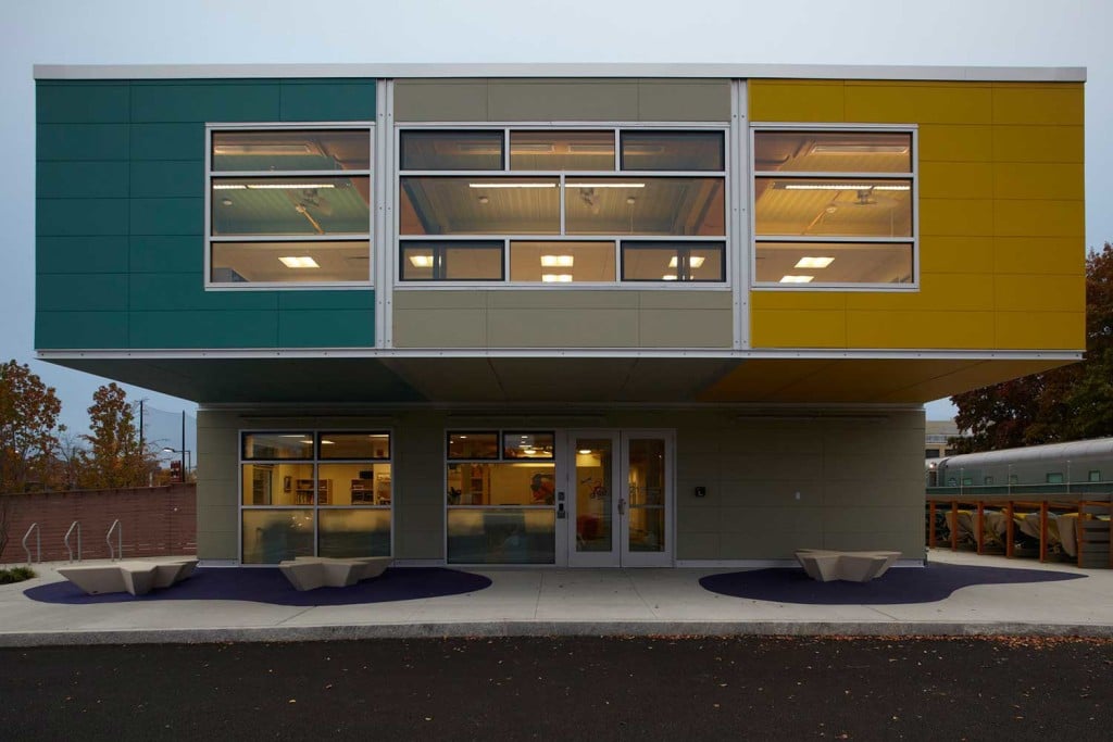 Modern triumph modular building showcasing vibrant colors and large windows, exemplifying modular construction techniques for permanent and temporary modular buildings.