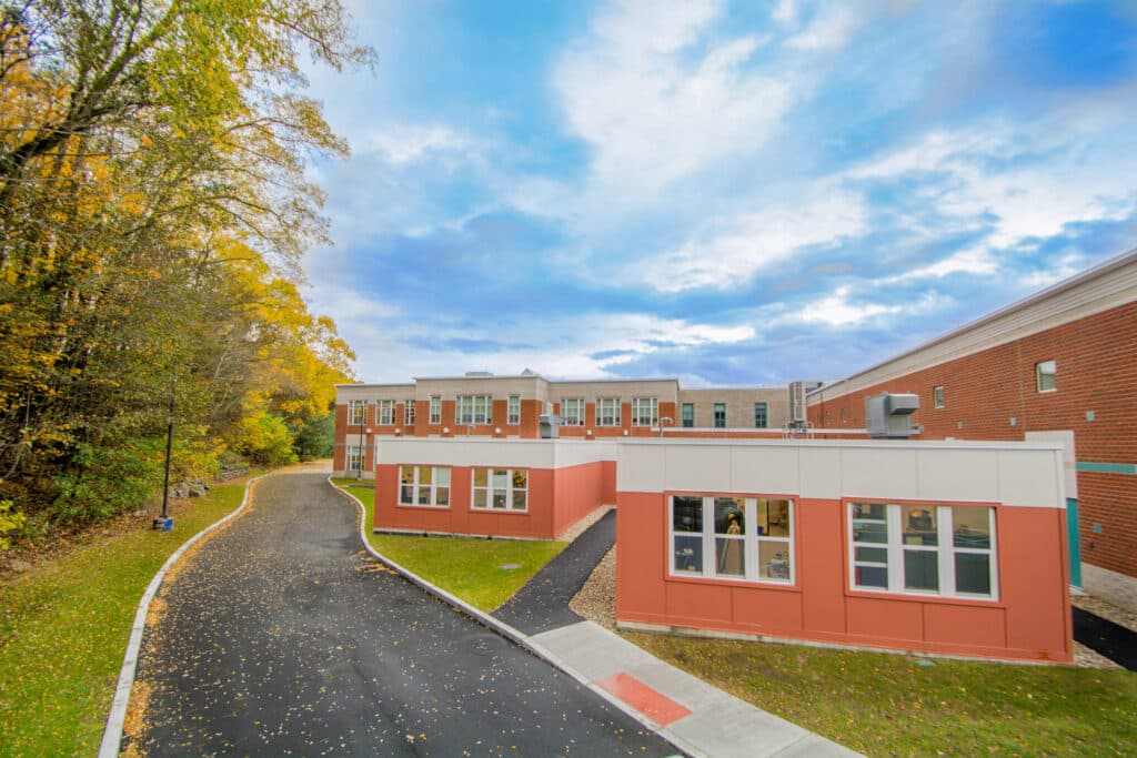 triumph modular classrooms next to school building