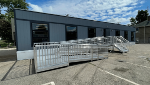 Accessible ramp leading to a triumph modular building, showcasing features of modular construction and its suitability for permanent and temporary modular building solutions.