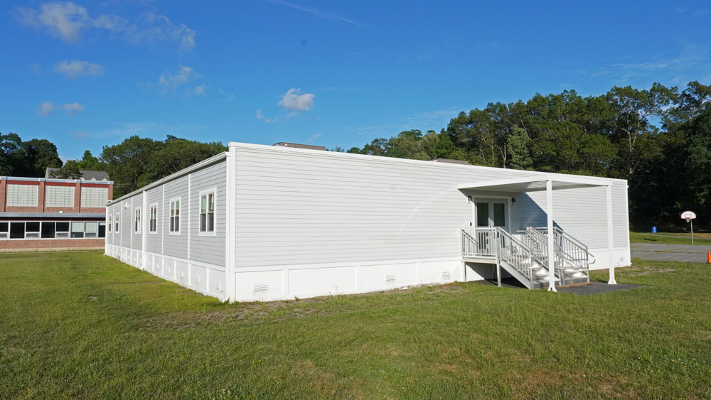 permanent modular classroom next to school basketball court